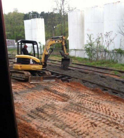 Michael filling the track with gravel.jpg